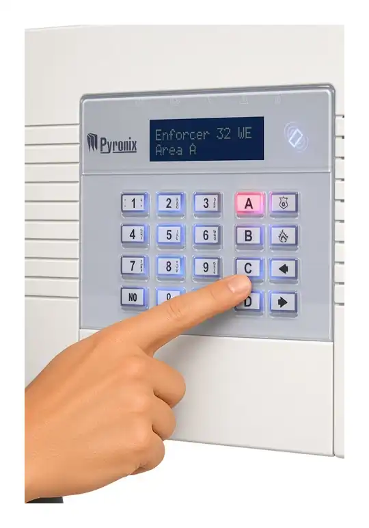 Finger pressing the C key on a Pyronix Enforcer keypad